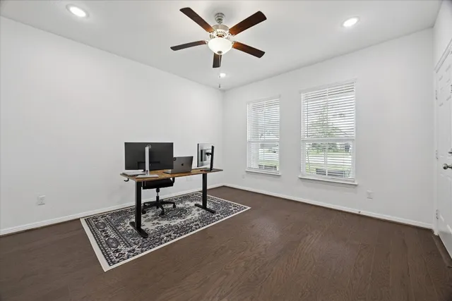 a work room with furniture and a window