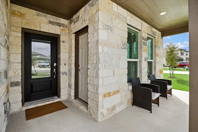 a view of living room couch and a floor to ceiling window