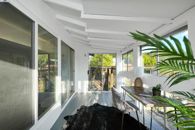 a kitchen with a sink and a large window