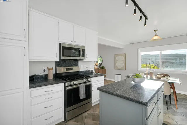a living room with furniture and a gate