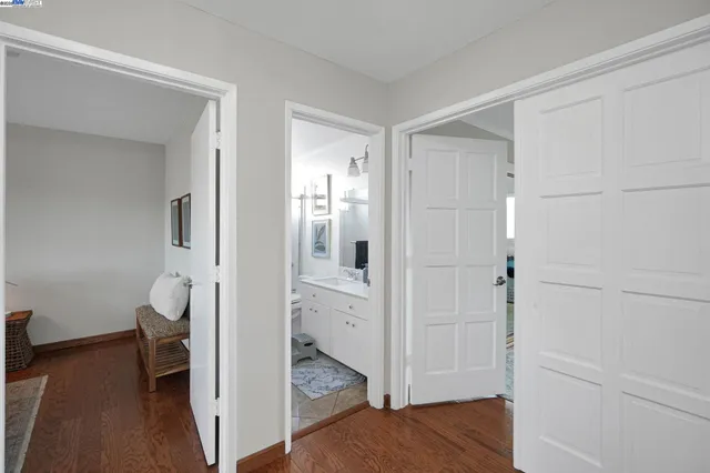 a bedroom with a bed and chair