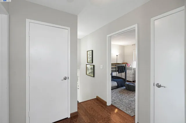 a bedroom with a bed and mirror