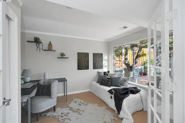 a living room with furniture a rug and a table