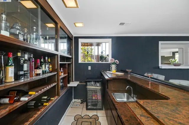 a view of a patio with table and chairs and potted plants