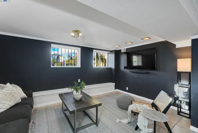 a view of a patio with a table and chairs and potted plants