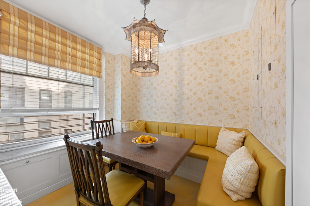 875 Park Avenue, Unit 8C Manhattan, NY 10075 - Photo 7 of 13 a view of a dining room with furniture and window