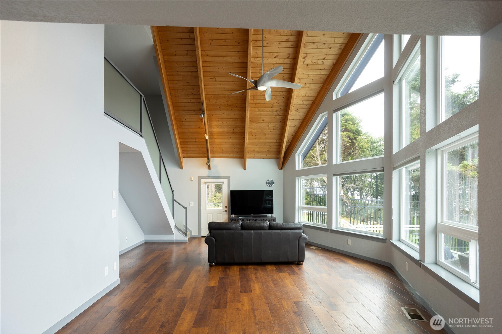 4631 Highway 109 Moclips, WA 98562 - Photo 11 of 35 a living room with furniture and a flat screen tv