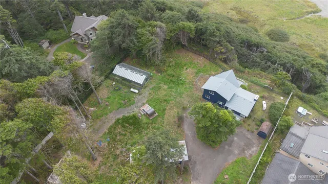 an aerial view of a house with a yard