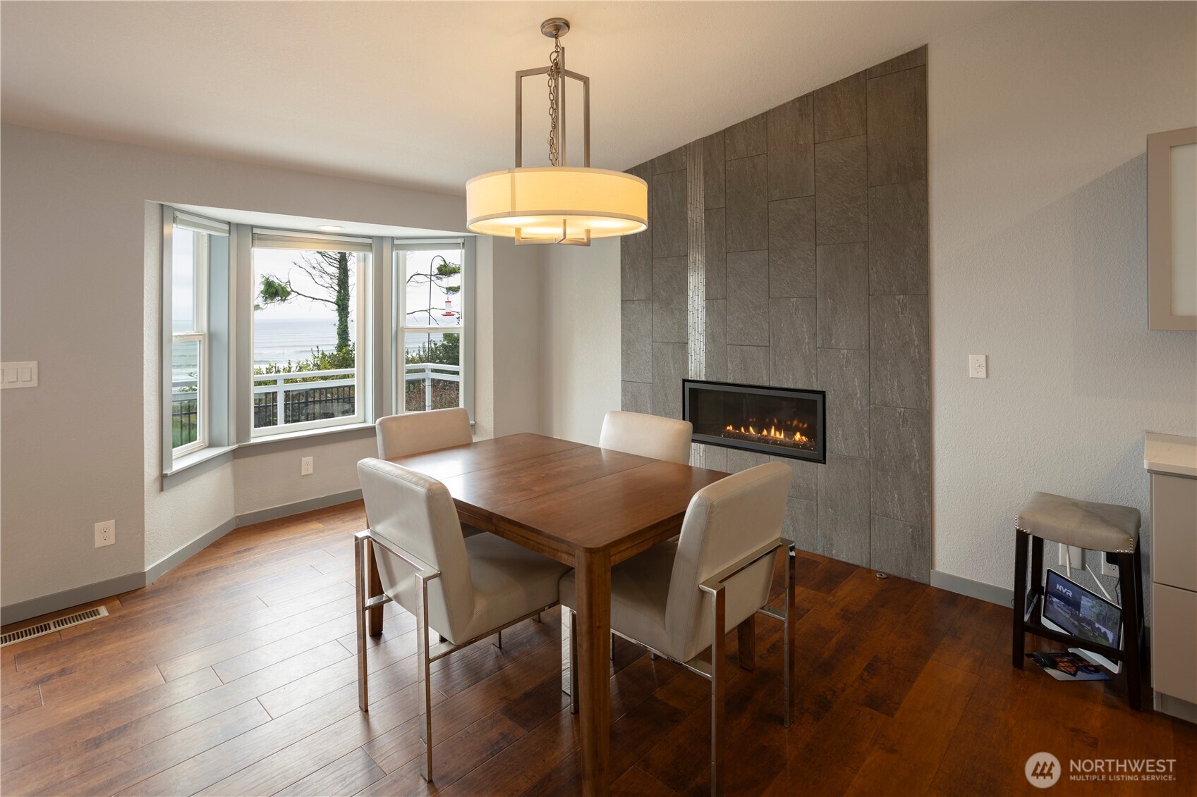 4631 Highway 109 Moclips, WA 98562 - Photo 10 of 35 a view of a dining room with furniture window and wooden floor
