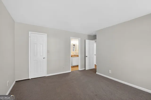 a view of an empty room and a window