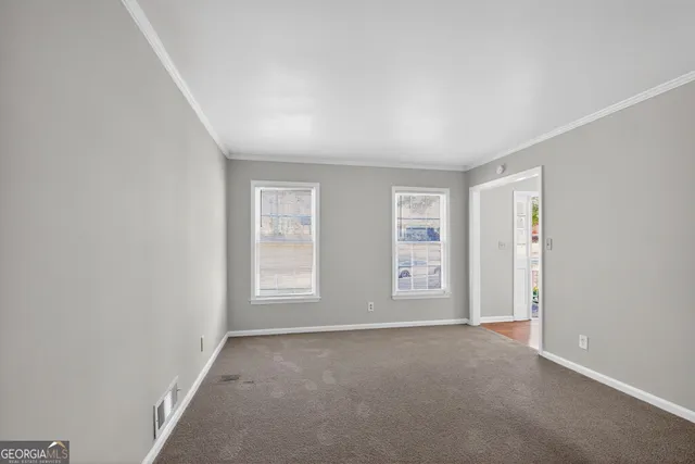 an empty room with windows