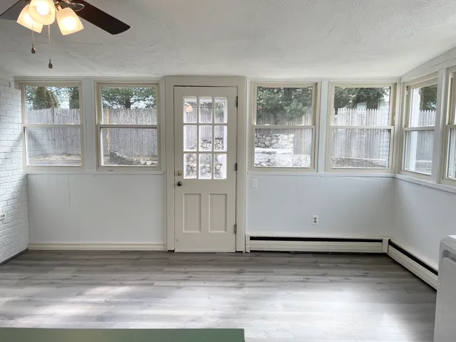 a view of a bathroom with a sink and a mirror