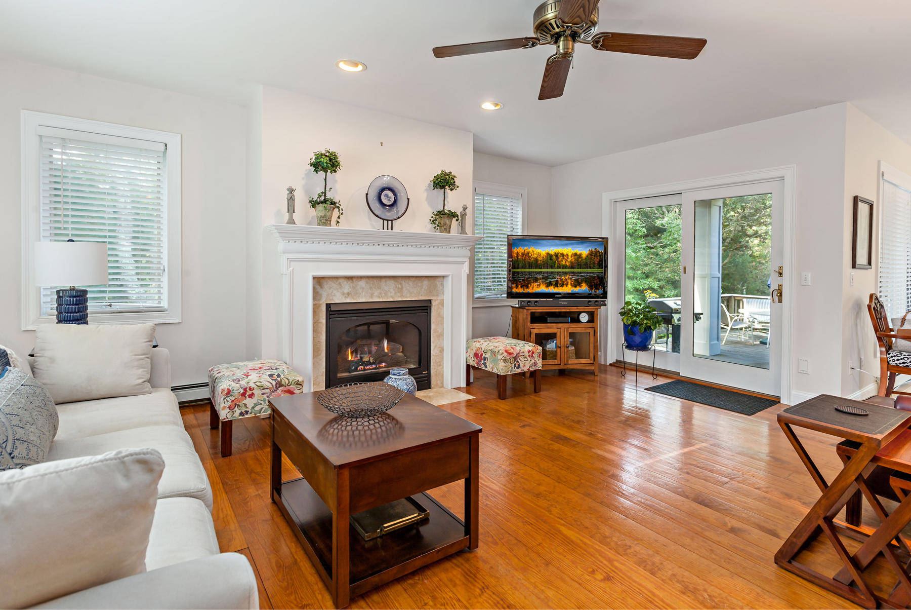 131 Rickenbacker Road East Falmouth, MA 02536 - Photo 4 of 34 a living room with furniture and a fireplace