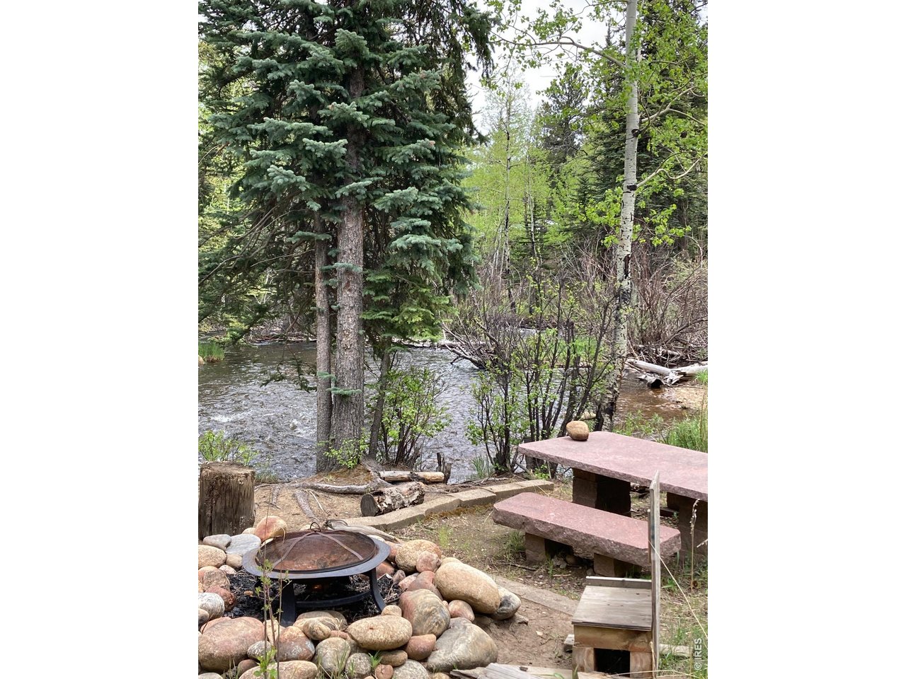 1064 Cold Springs Road Nederland, CO 80466 - Photo 42 of 48 a view of a balcony with chair and a potted plant
