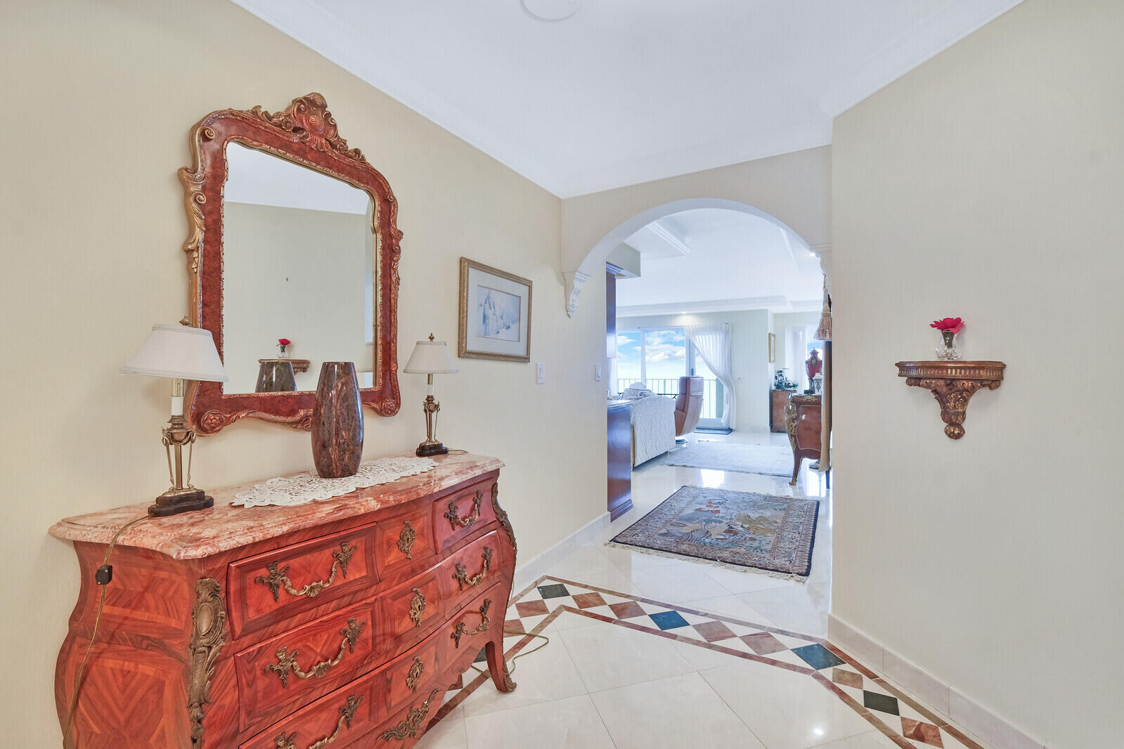 4001 North Ocean Boulevard, Unit B1201 Boca Raton, FL 33431 - Photo 12 of 42 a bedroom with a large bed and a mirror