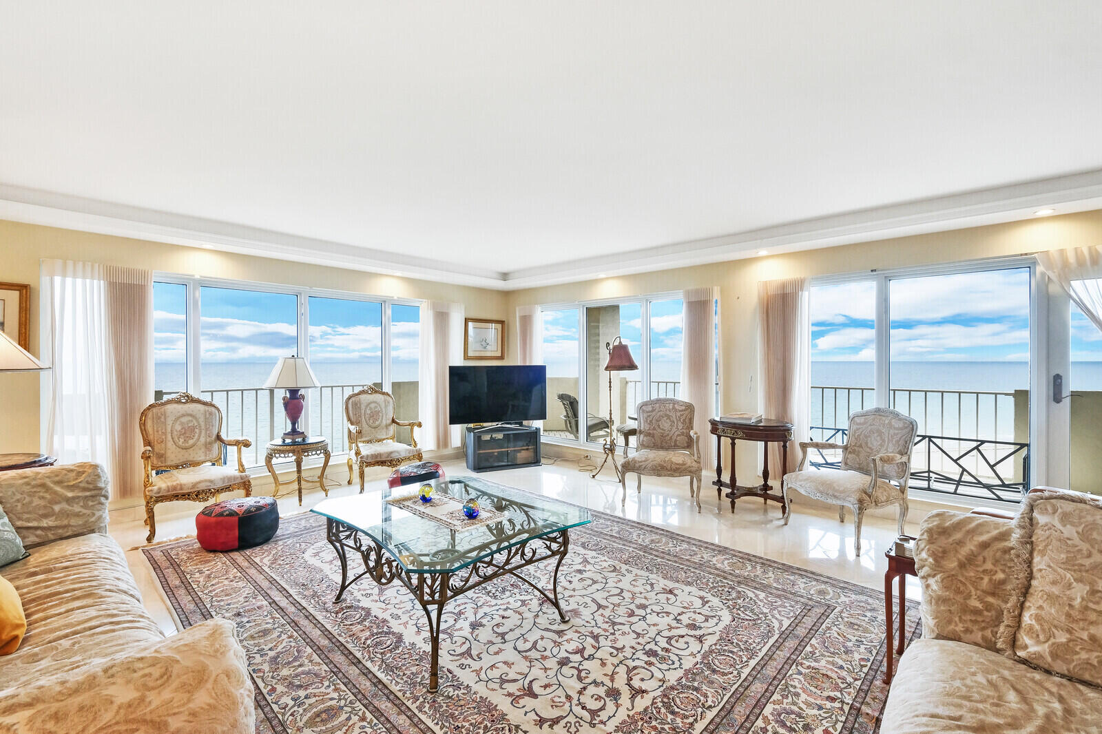 4001 North Ocean Boulevard, Unit B1201 Boca Raton, FL 33431 - Photo 16 of 42 a living room with furniture wooden floor and a large window