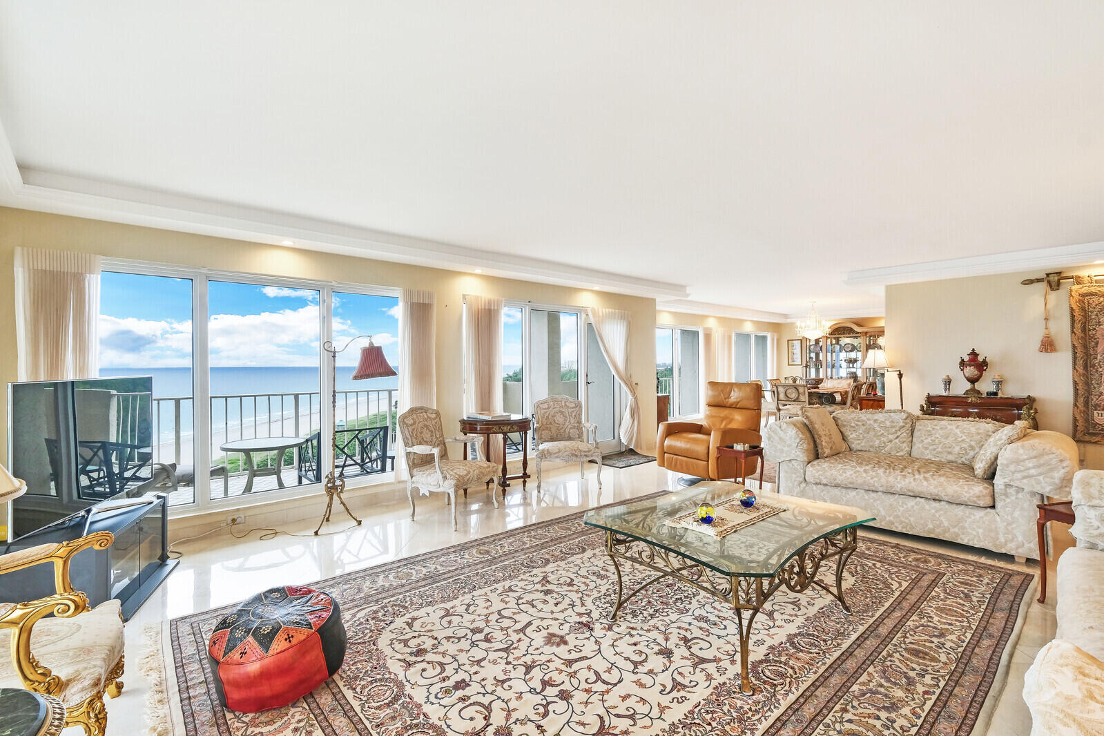 4001 North Ocean Boulevard, Unit B1201 Boca Raton, FL 33431 - Photo 17 of 42 a living room with furniture and a large window