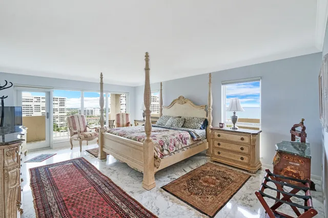 a bed room with a bed and dresser