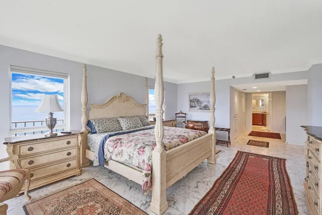 a spacious bathroom with a granite countertop sink and a mirror