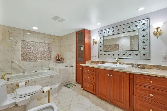 a bathroom with a shower and a sink