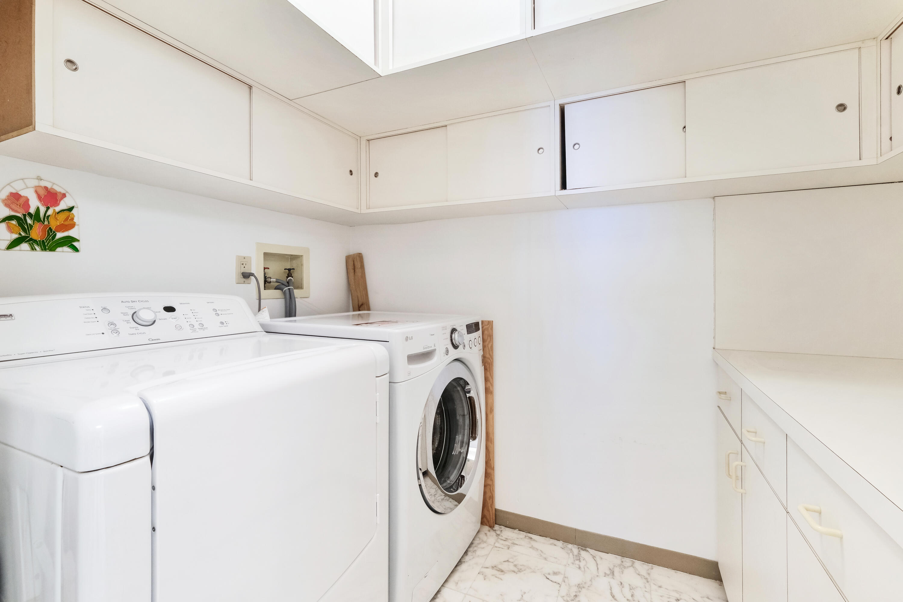 4001 North Ocean Boulevard, Unit B1201 Boca Raton, FL 33431 - Photo 32 of 42 a utility room with dryer and washer