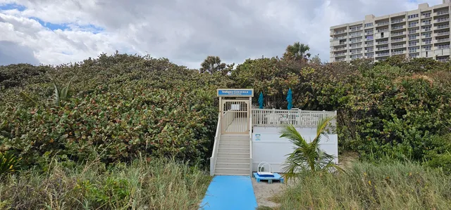 a view of a chair and table in the balcony