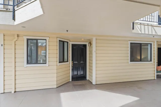 a view of a house with large windows