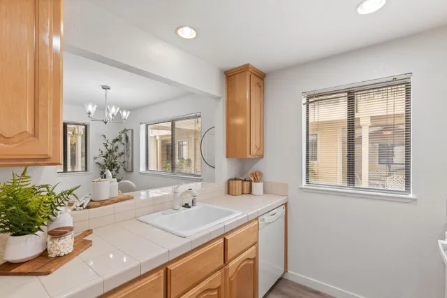 a bathroom with a sink vanity granite and a mirror