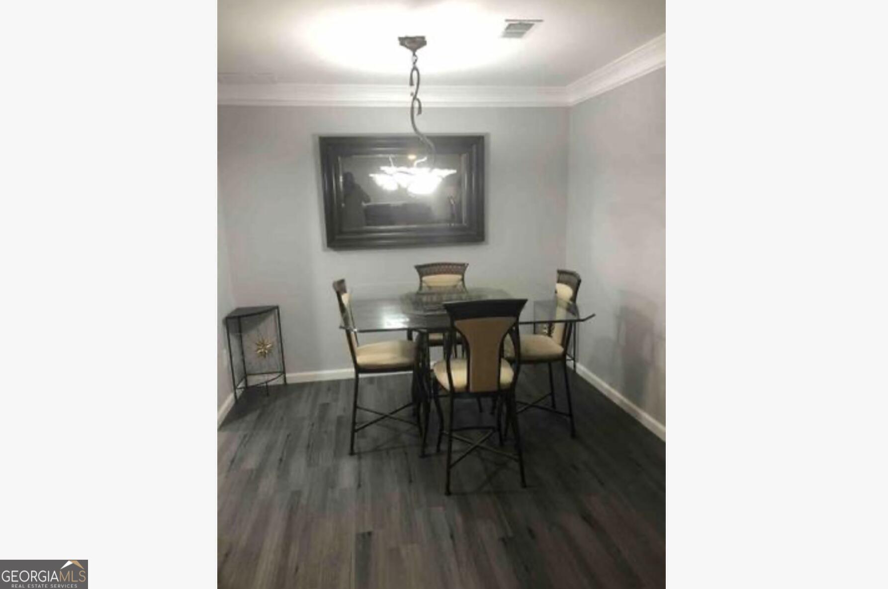 3834 Kensingwood Trace Decatur, GA 30032 - Photo 21 of 26 a dining room with furniture and wooden floor
