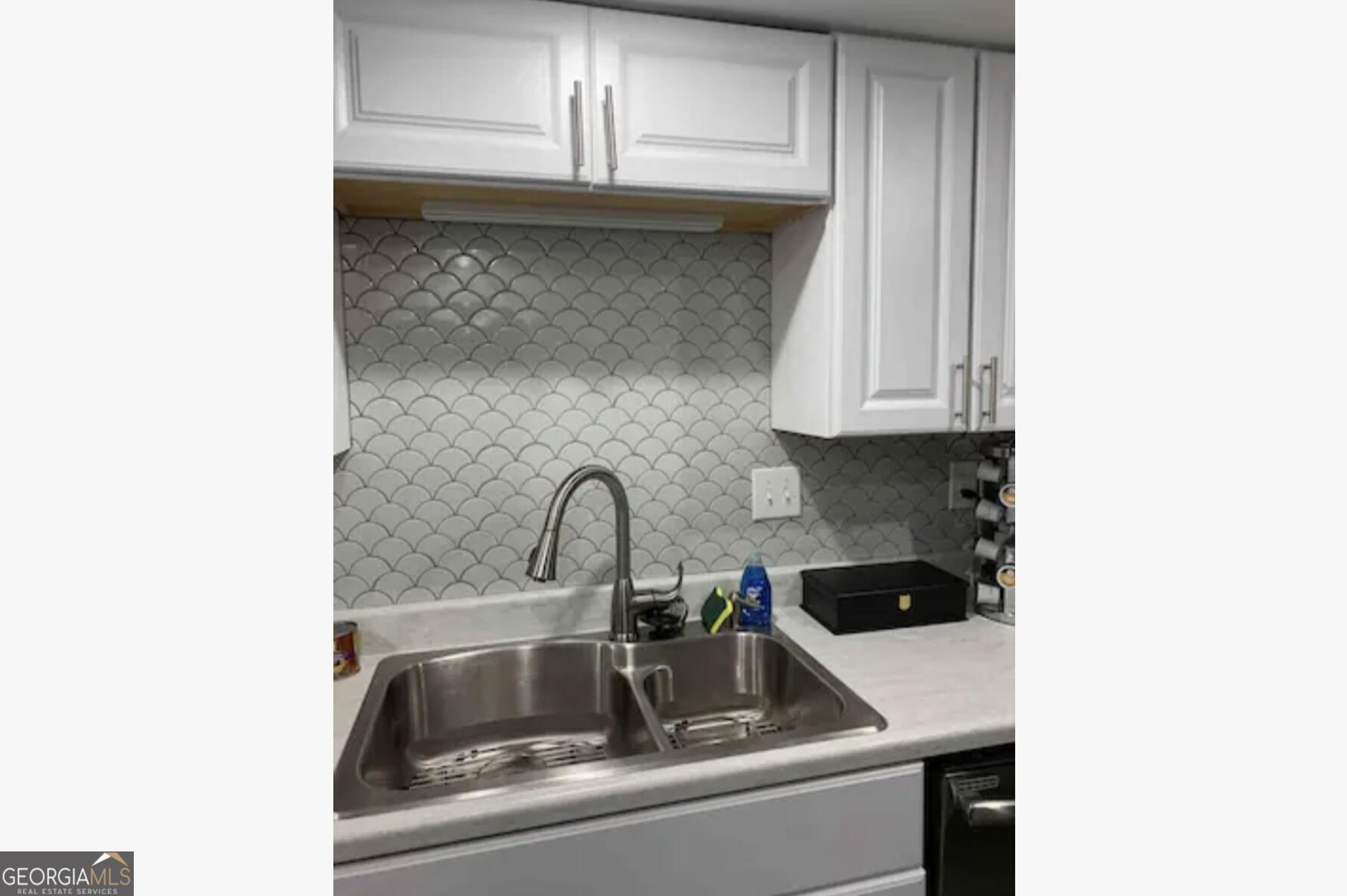3834 Kensingwood Trace Decatur, GA 30032 - Photo 23 of 26 a close view of a sink and dishwasher in kitchen