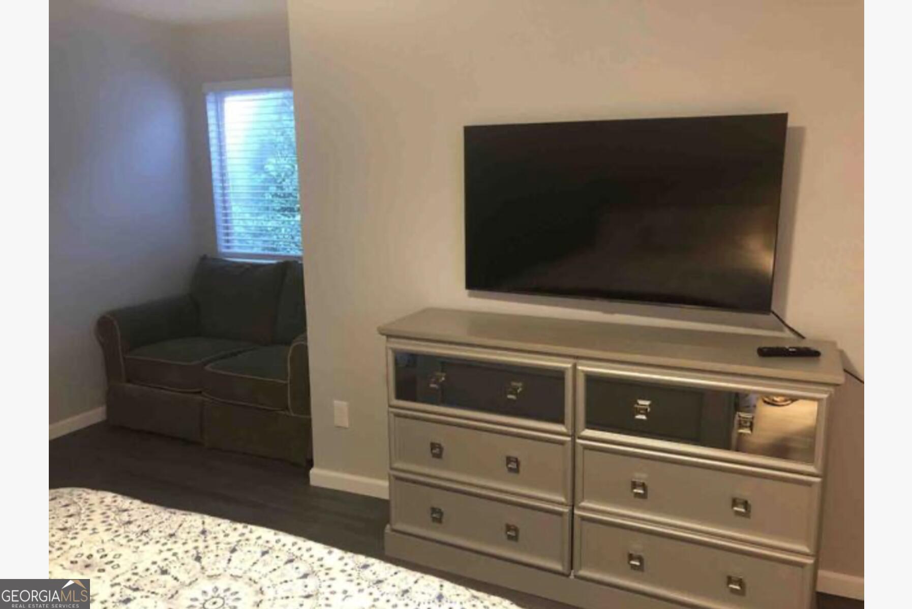 3834 Kensingwood Trace Decatur, GA 30032 - Photo 5 of 26 a living room with furniture and a flat screen tv