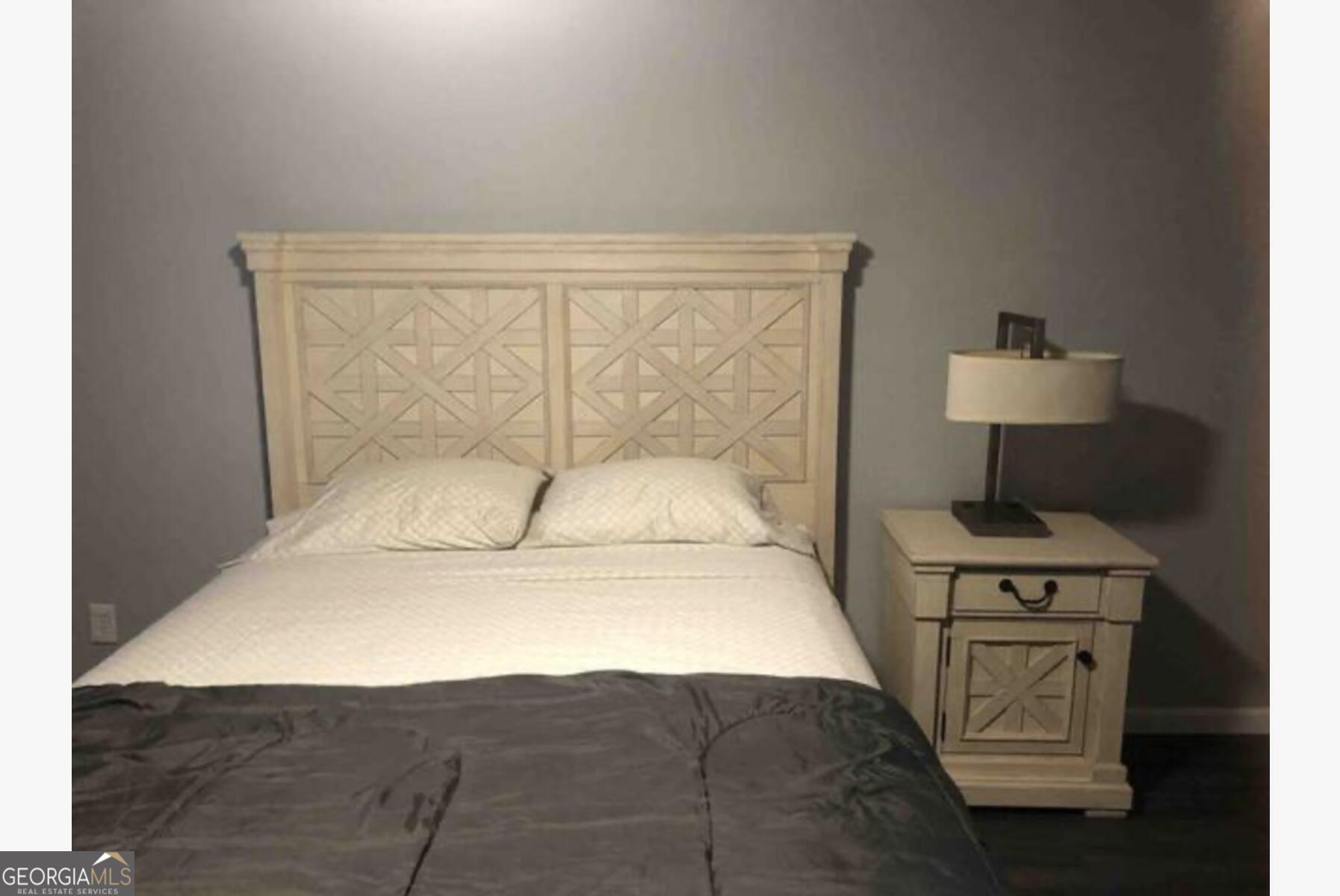 3834 Kensingwood Trace Decatur, GA 30032 - Photo 6 of 26 a bedroom with a bed and a chair