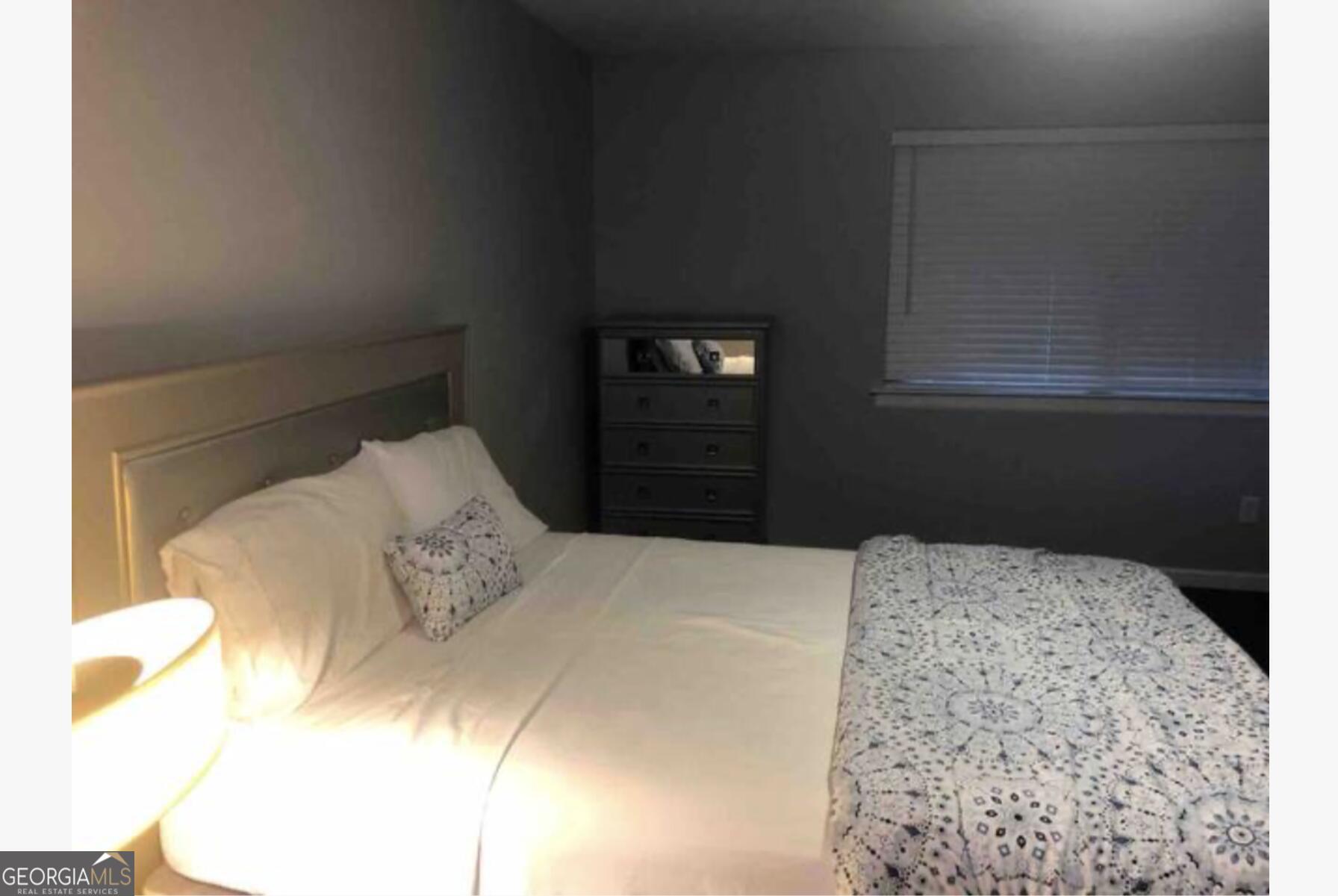 3834 Kensingwood Trace Decatur, GA 30032 - Photo 10 of 26 a bedroom with a bed and a window