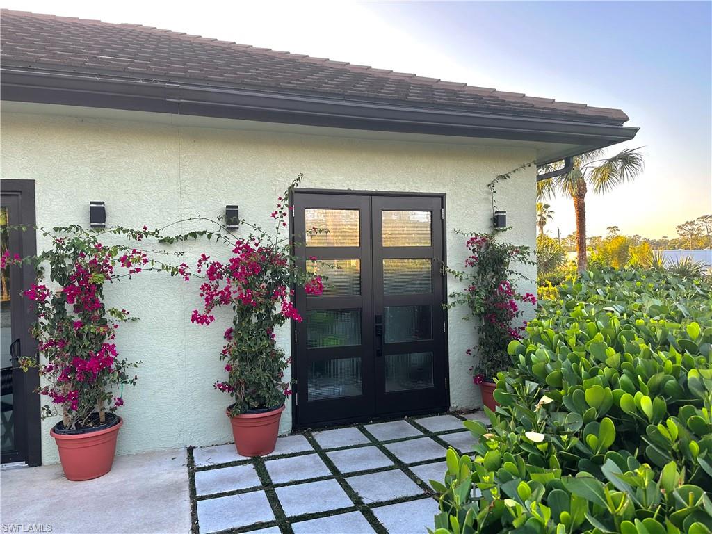 1391 Oakes Boulevard Naples, FL 34119 - Photo 16 of 43 main entry door