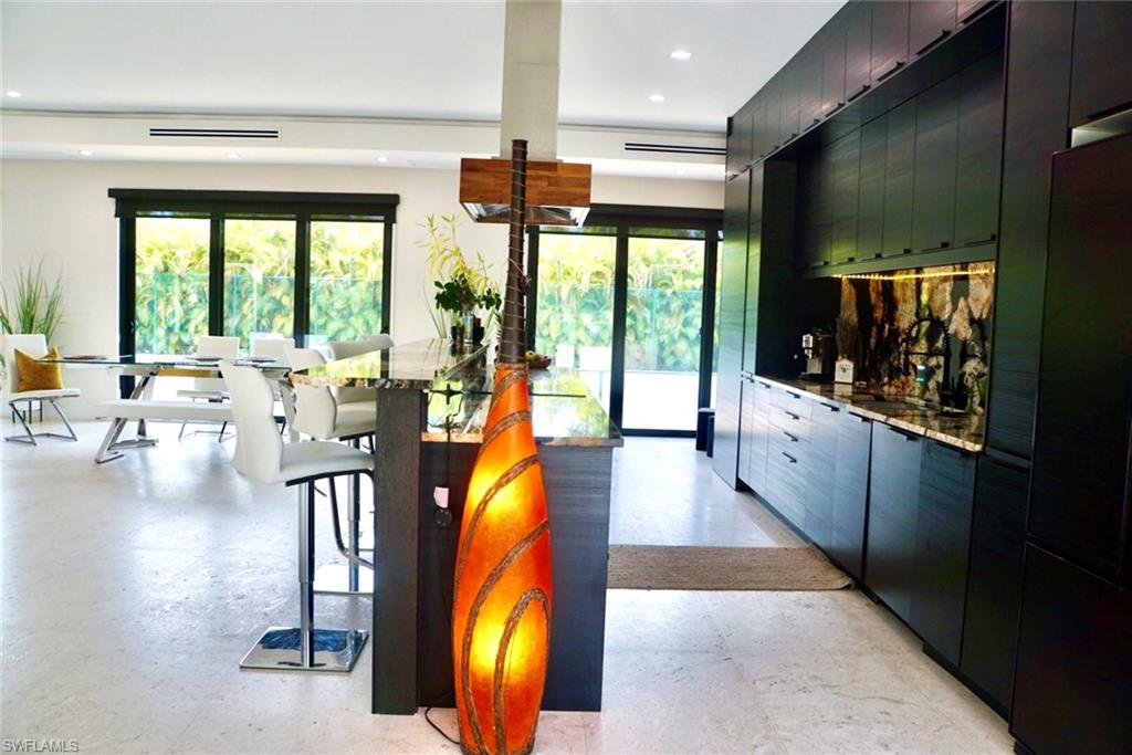 1391 Oakes Boulevard Naples, FL 34119 - Photo 25 of 43 Kitchen featuring plenty of natural light