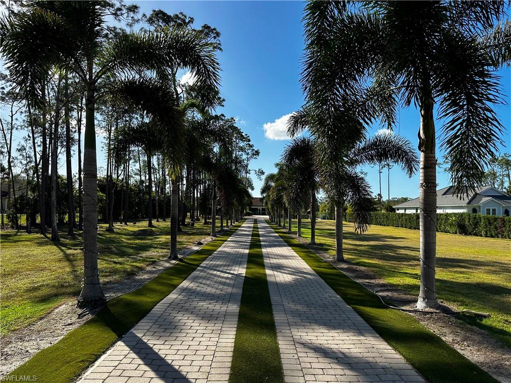 1391 Oakes Boulevard Naples, FL 34119 - Photo 3 of 43 driveway view from the gate