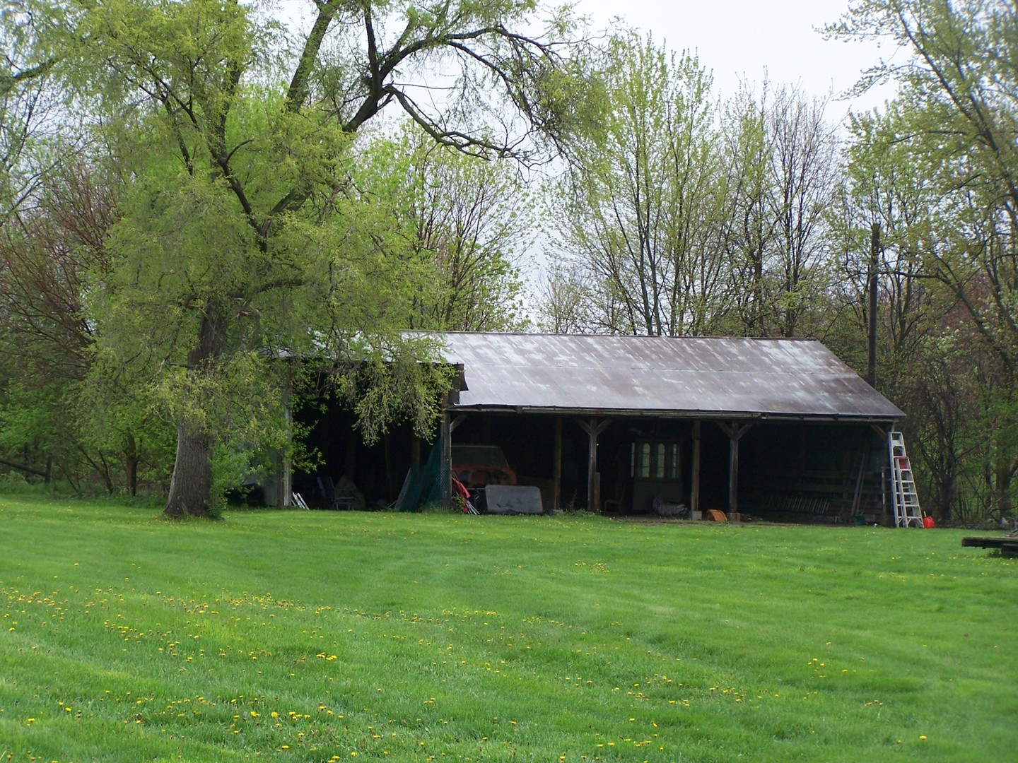 13810 Davis Road Woodstock, IL 60098 - Photo 9 of 13 a front view of house with a garden