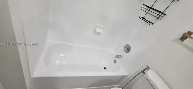 a view of living room with a table and a window