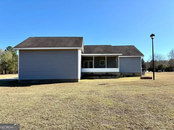 a house that has a tree in front of it