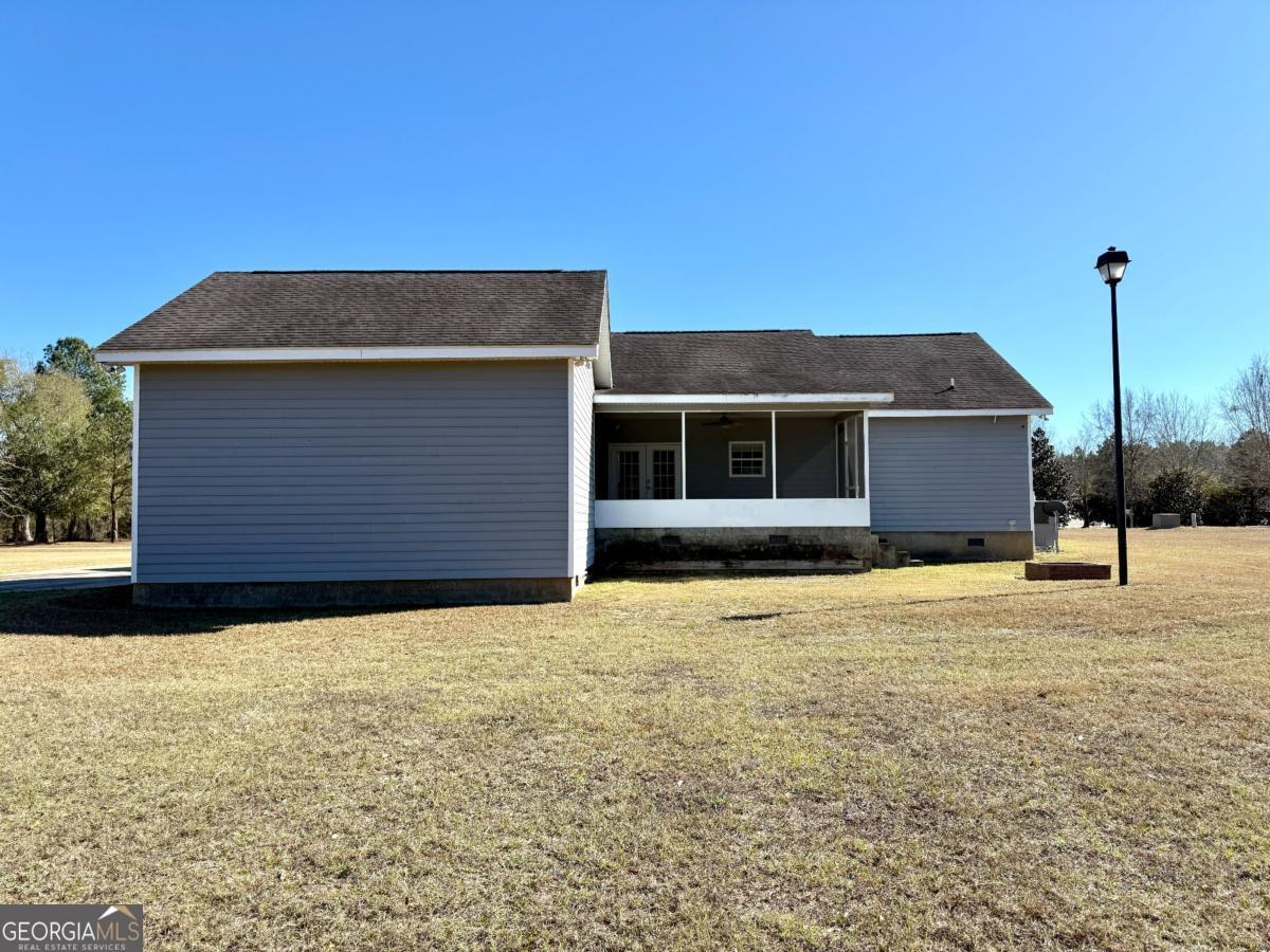 147 Landing Road Cordele, GA 31015 - Photo 23 of 24 a house that has a tree in front of it