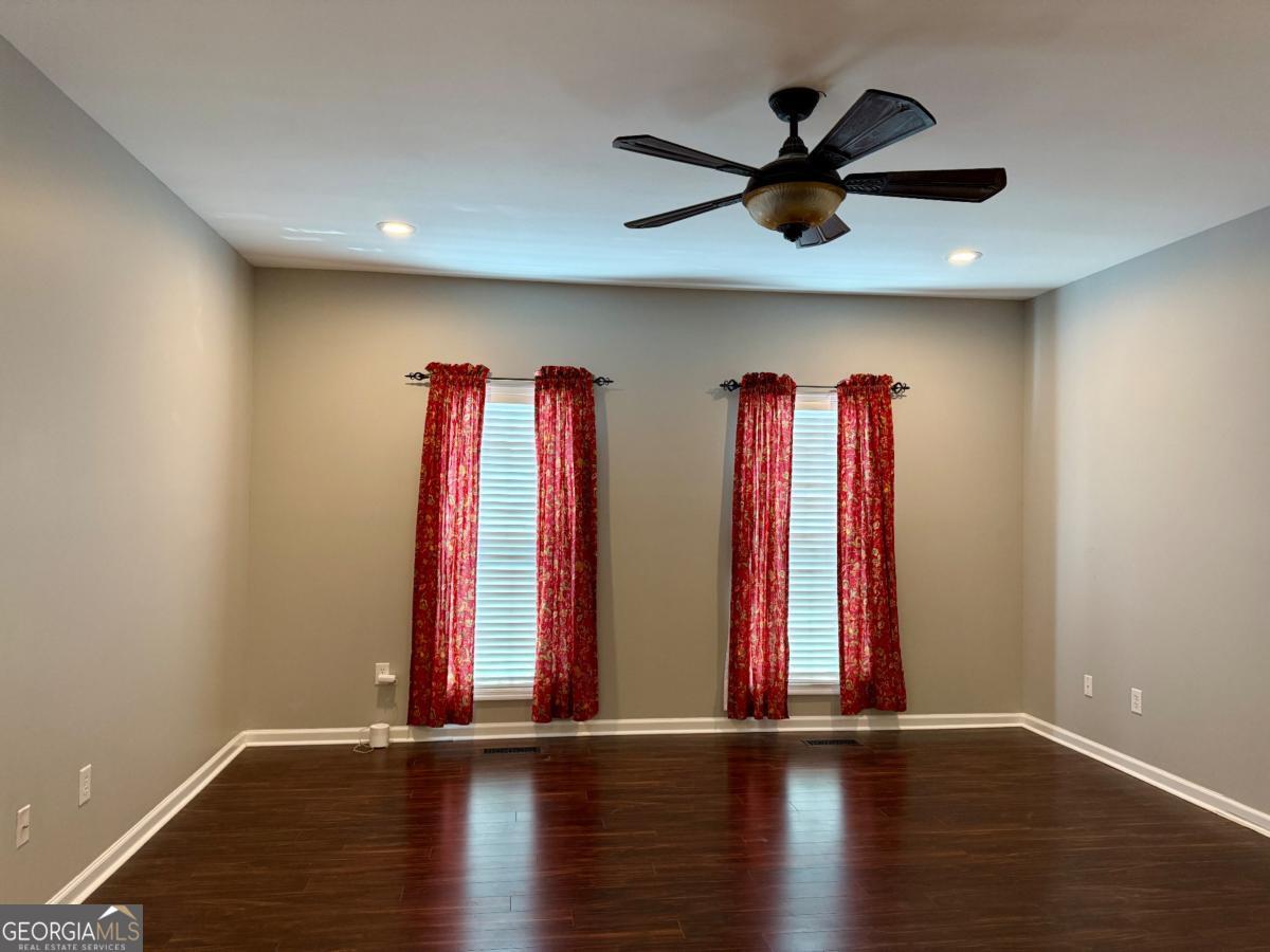 147 Landing Road Cordele, GA 31015 - Photo 7 of 24 a view of a room with wooden floor and a window