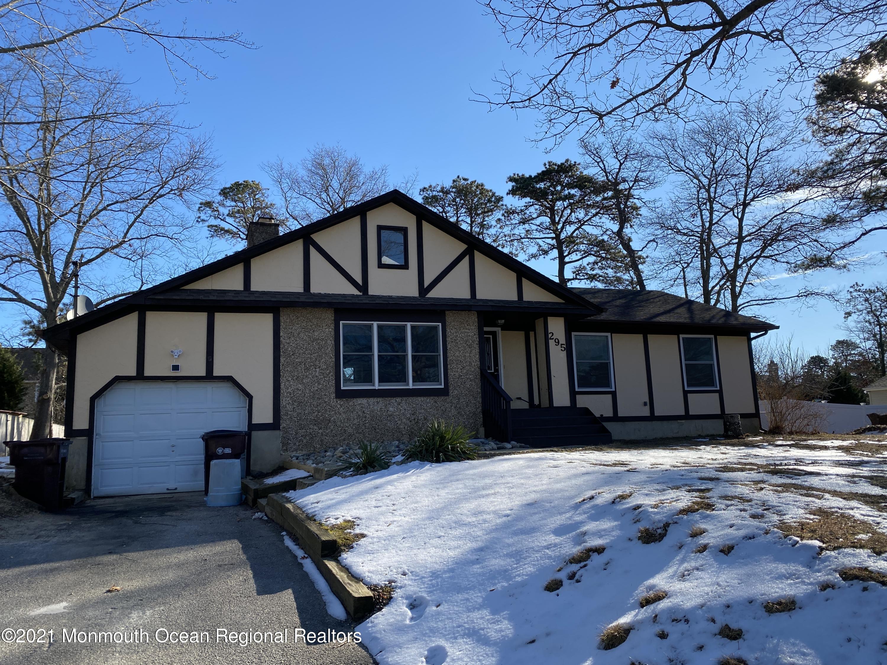 295 Western Boulevard Bayville, NJ 08721 - Photo 2 of 11 a front view of a house with a yard