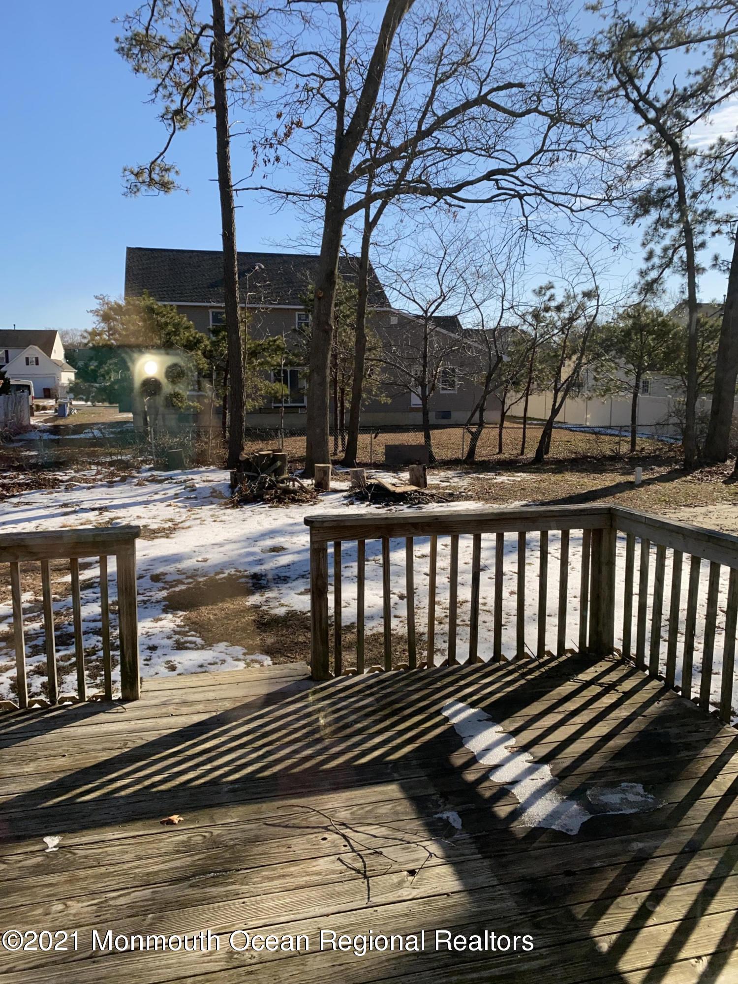 295 Western Boulevard Bayville, NJ 08721 - Photo 11 of 11 a view of a balcony with a bench