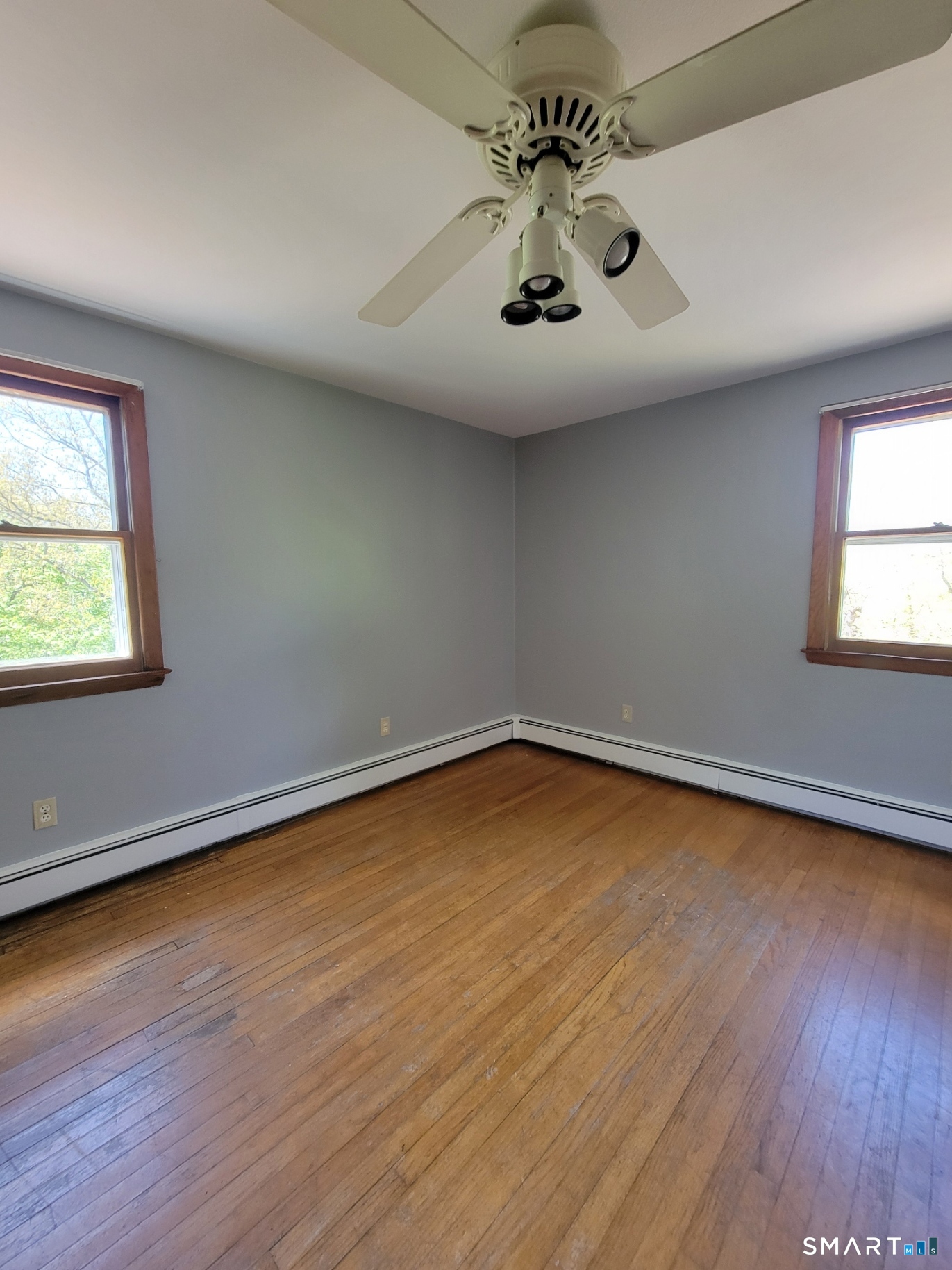 18 Parsonage Road Haddam, CT 06441 - Photo 8 of 12 an empty room with wooden floor and windows
