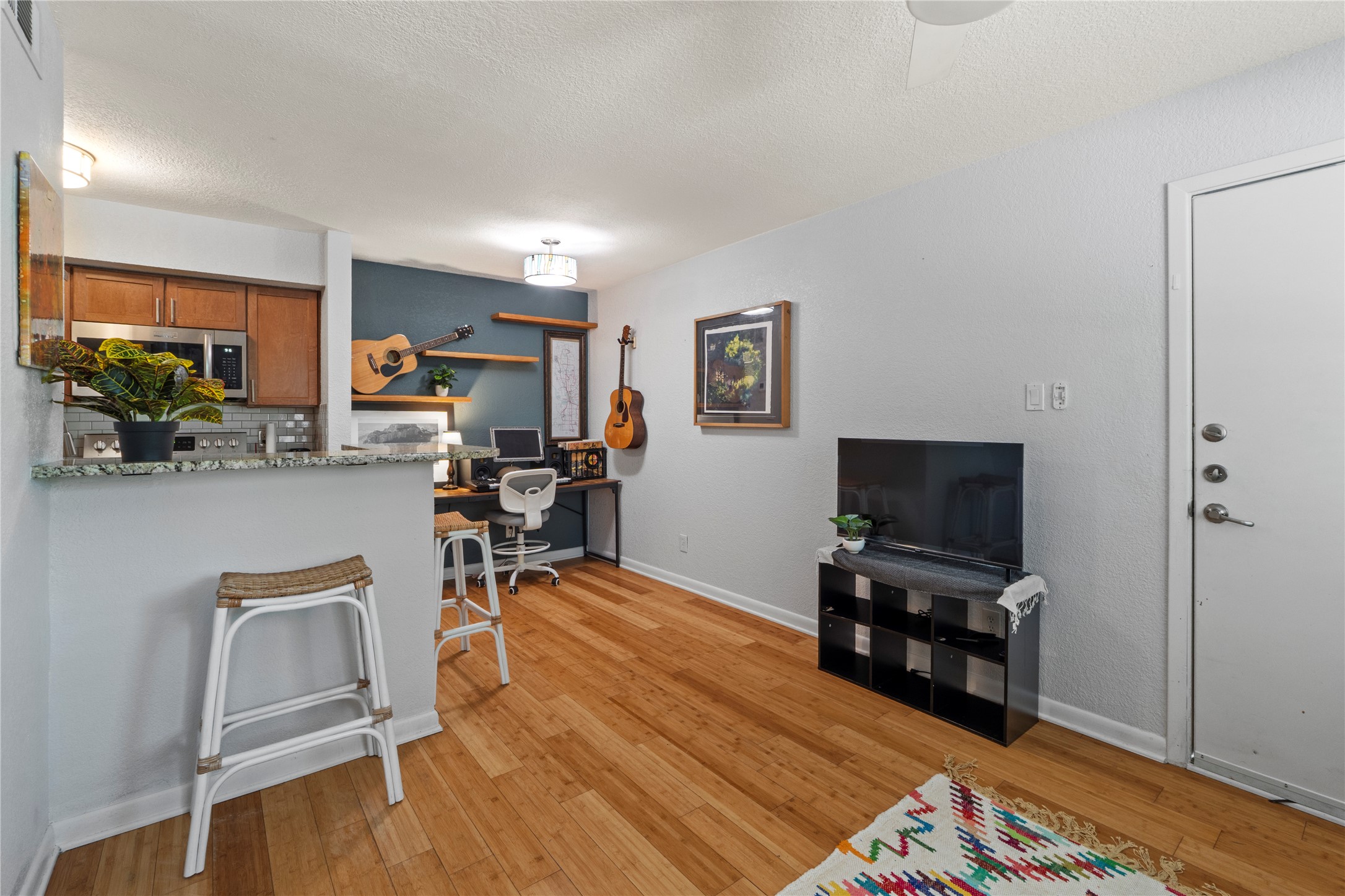 3204 Menchaca Road, Unit 305 Austin, TX 78704 - Photo 15 of 25 Envision this space as a 2nd dining area, as additional living room seating, or as a home office, as pictured.