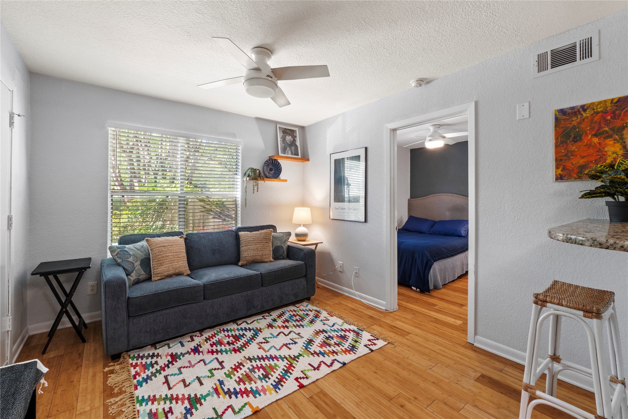 3204 Menchaca Road, Unit 305 Austin, TX 78704 - Photo 3 of 25 Lounge and relax in the well-lit living space fitting of a sleeper sofa for guests!