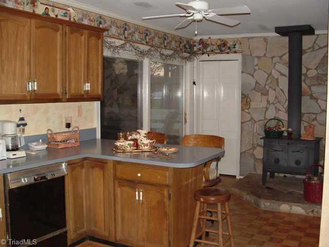 2514 Shady Grove Church Road Staley, NC 27355 - Photo 3 of 9 Other. Large country kitchen with double ovens, breakfast bar, lovely parquet flooring and wood stove