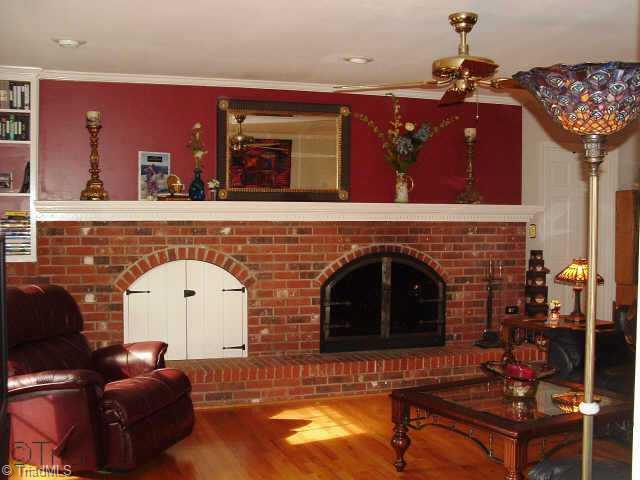 2514 Shady Grove Church Road Staley, NC 27355 - Photo 4 of 9 Other. Spacious Family room has lovely hardwood flooring, masonry fireplace with raised brick hearth, and a ceiling fan. Den opens to back deck which has a hot tub.