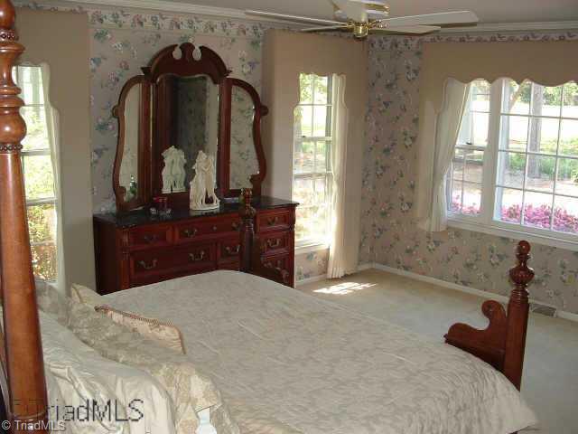 2514 Shady Grove Church Road Staley, NC 27355 - Photo 5 of 9 Other. Main level owner s suite with crown moldings, ceiling fan and adjoining bath. Connects to Den and boasts a lovely view of side pasture from multiple windows.