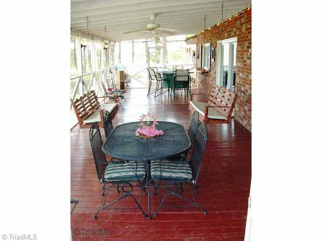 2514 Shady Grove Church Road Staley, NC 27355 - Photo 7 of 9 Other. Oversized screened porch with plenty of room for multiple eating and entertaining spaces.